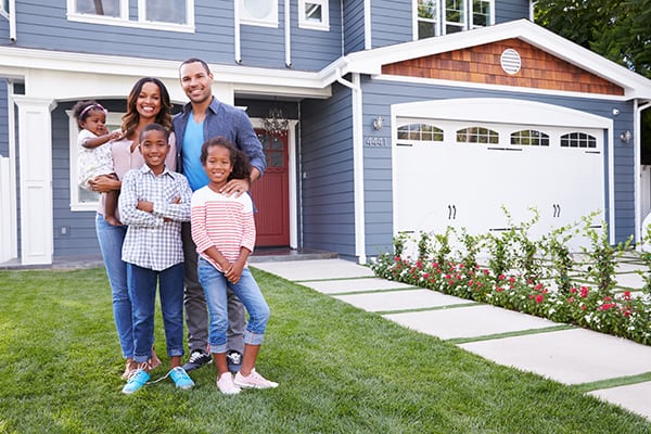happy family in front of a childproof garage